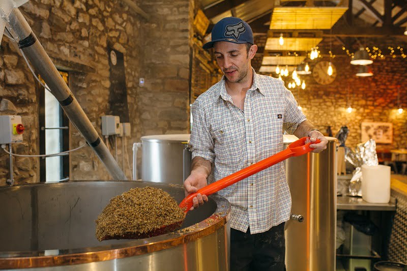 Stuart Taylor brewing on-site at The Royal Barn. Photo by Emma Dickinson Photography