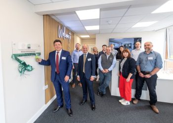 Neil Jefferson, managing director of Home Builders Federation, cuts the ribbon at Genesis Homes' new HQ