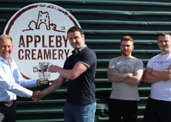 Kerry Love presents the Sean Wilson trophy to operations manager Tom Jackson, watched by Tom Bucknall, the creamery's Maker Space co-ordinator (second from right) and Alex Jackson, head cheesemaker