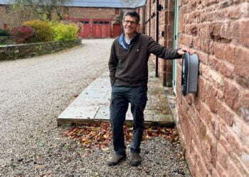 Charles Rowley with a Zappi EV charging point.
