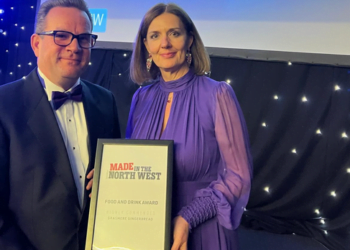 Award winners holding a "Made in the North West" plaque.