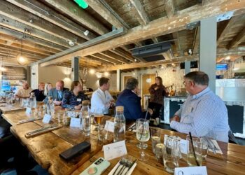 Business meeting in rustic-themed restaurant.