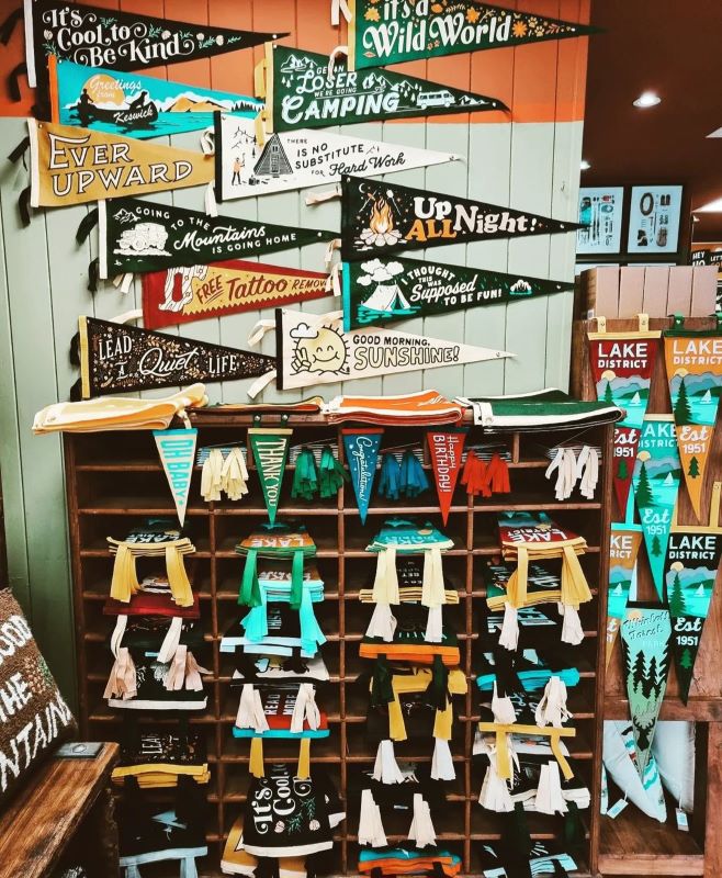 Colourful display of motivational banners and hangings in a shop.