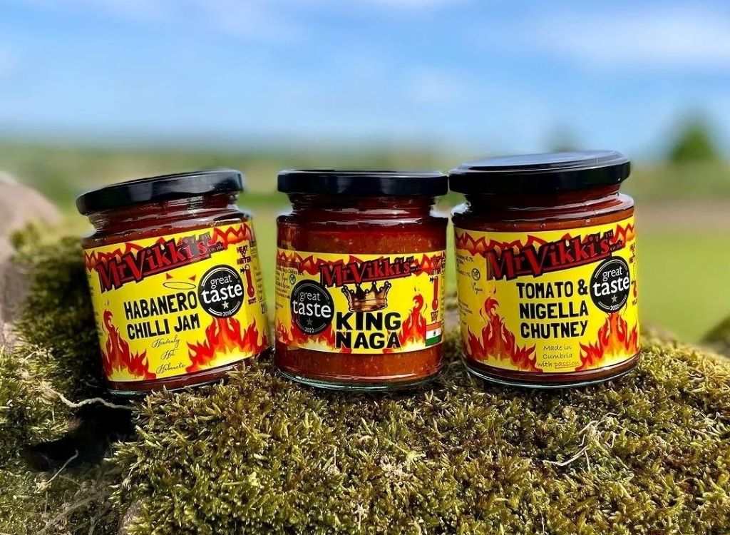 Mr Vikki's chilli jam, naga, chutney jars outdoors.