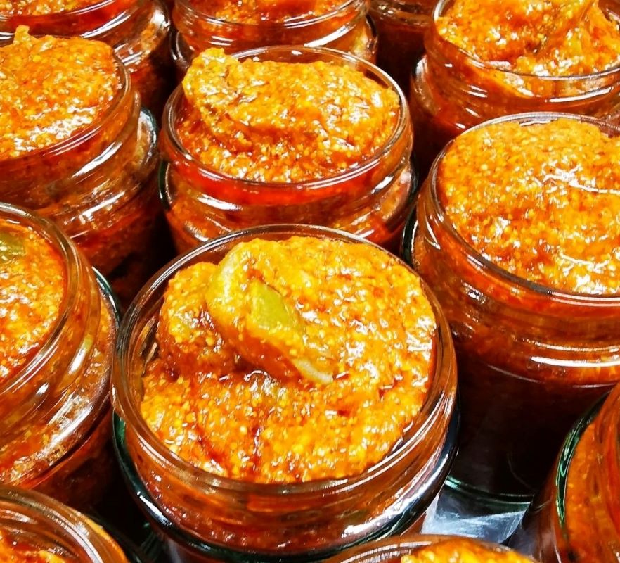 Jars of homemade orange chilli paste.
