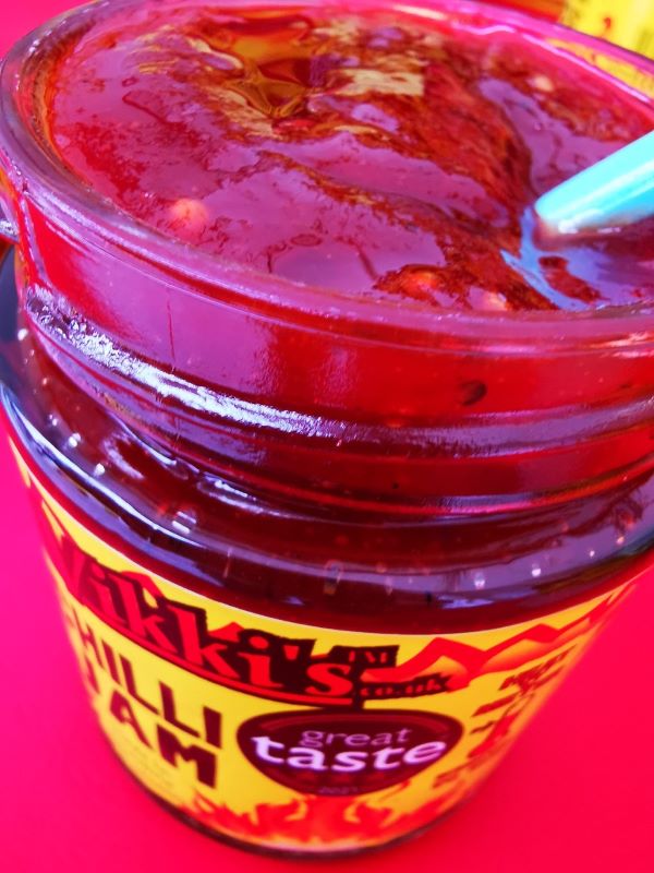 Jar of spicy chilli jam with great taste label.