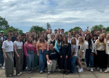 Group photo of people outdoors.