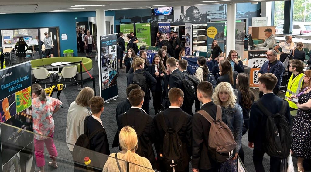 Students and exhibitors at a career fair event.