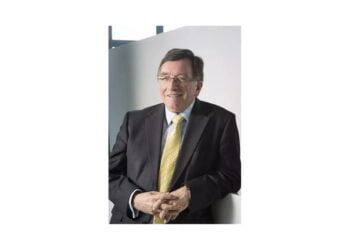 Man in suit with yellow tie smiling
