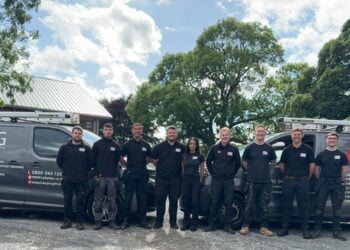 NPG Fire Safety staff standing in front of vans.