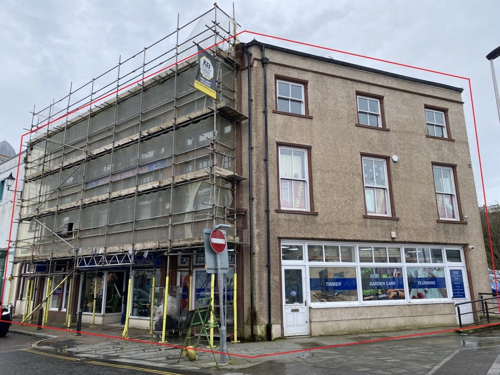Building with scaffolding undergoing renovation.