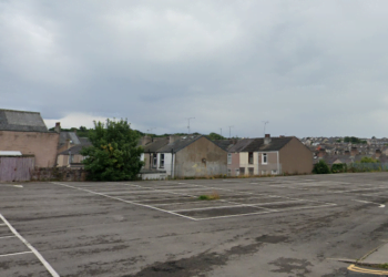 Empty car park near residential houses