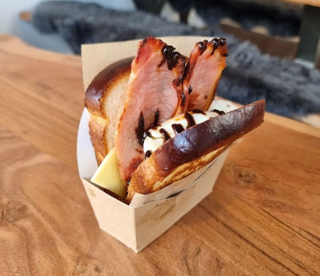 Bacon sandwich with cheese and sauce