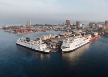 Ships docked at a city port.