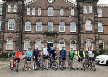 Cyclists in front of Fusehill Street campus, Carlisle