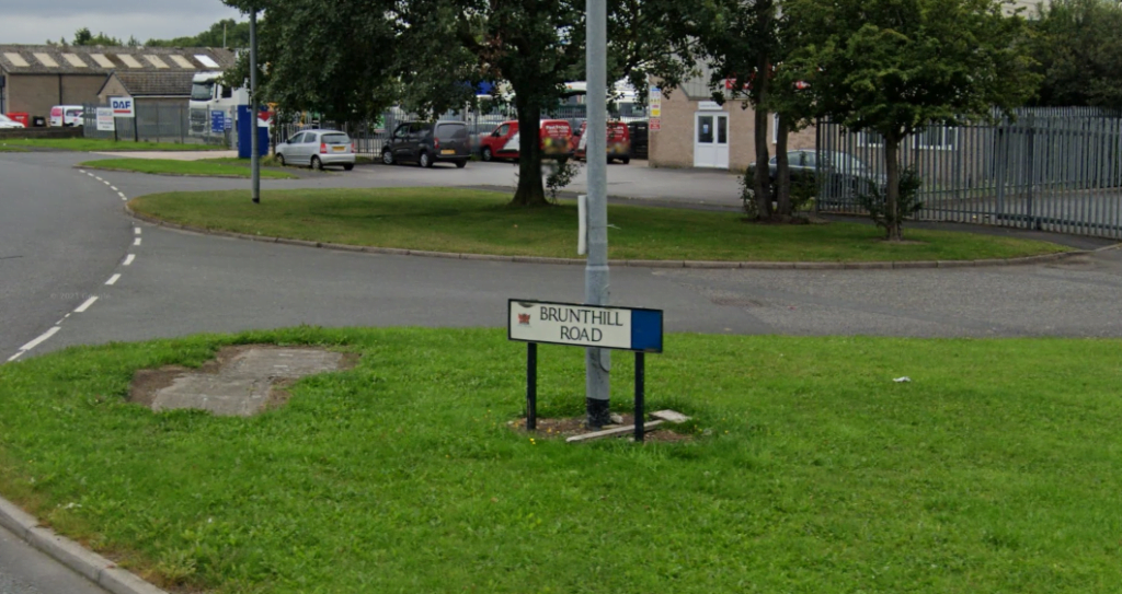 Brunthill Road sign in industrial area