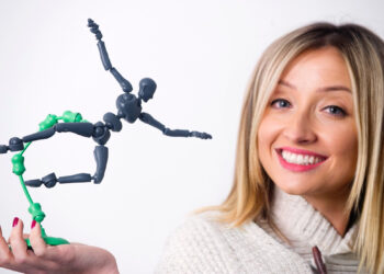 Woman holding a humanoid figurine