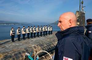 Submarine crew lined up on deck.