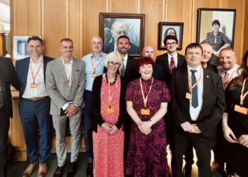 Group photo of people wearing conference badges.