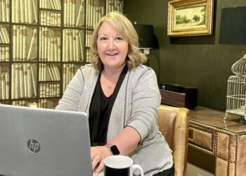 Woman working on laptop in home office