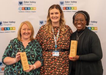 Three women holding awards at Eden Valley event.