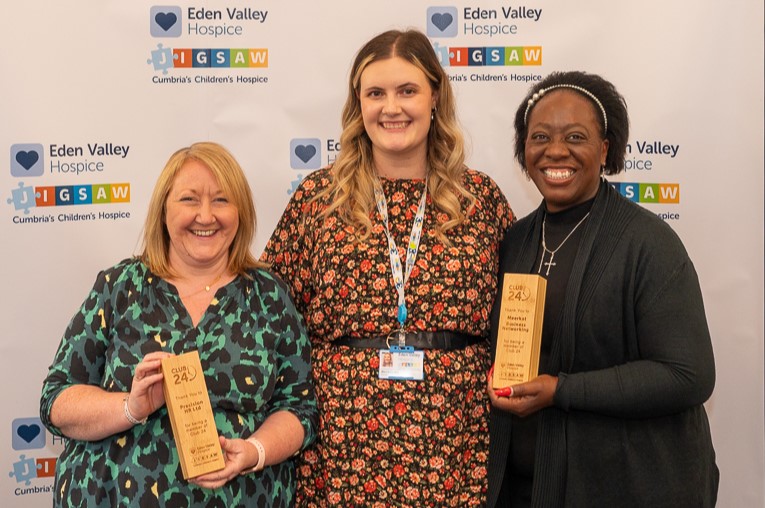 Three women holding awards at Eden Valley event.
