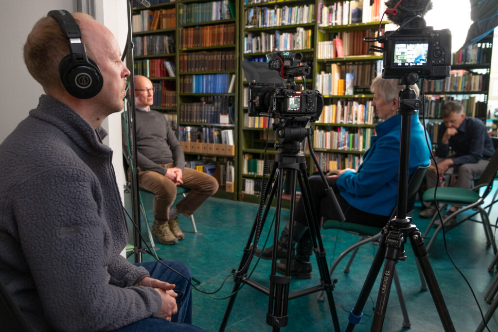 Library interview setup with camera recording.