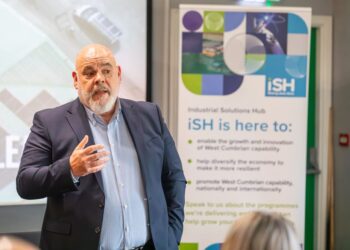 Man speaking at Industrial Solutions Hub event.