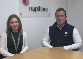Two people sitting in Napthens office.