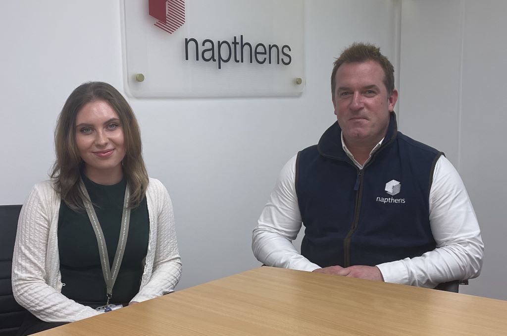 Two people sitting in Napthens office.