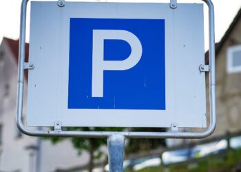 Blue parking sign on a metal post