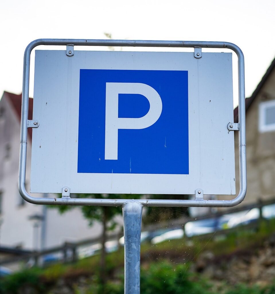 Blue parking sign on a metal post
