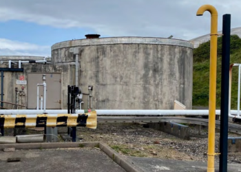 Industrial storage tanks with pipelines.