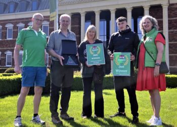 Outside the Dutch headquarters of the ACSI, David Jackson and his wife Jill and their son Josh receive the organisation's top UK award from two of its senior holiday park inspectors